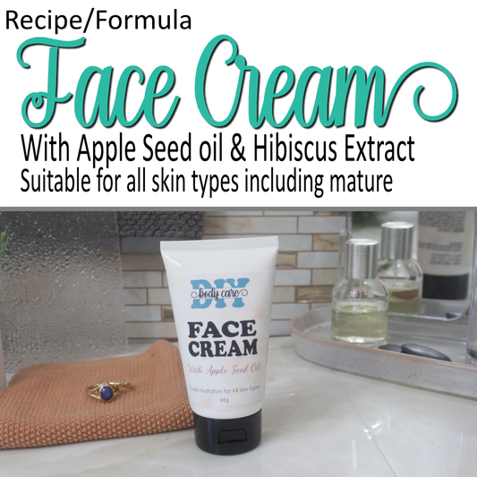 A cover photo where the top half is a white background with decorative teal text announcing this as a Face Cream Formula.  Additional plain text shows it has Apple Seed Oil and Hibiscus Extract and is suitable for all skin.  To the bottom of the image is a photo of a white tube with black cap sitting on a bathroom countertop.  It is labelled as Face Cream with apple seed oil.  It is surrounded by bathroom accessories.