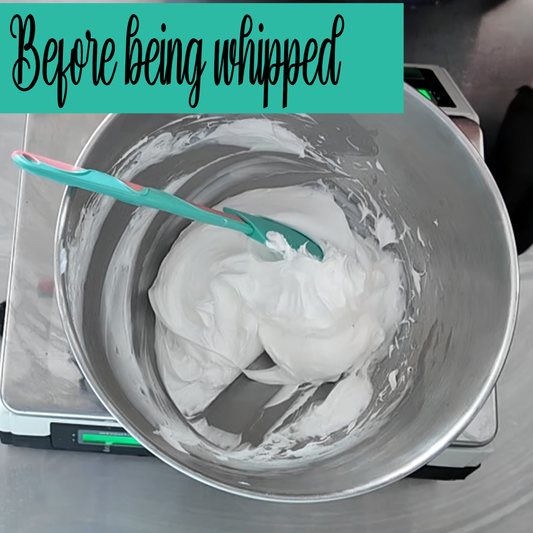 A silver mixing bowl with some Foaming Bath whip and a spatula.  Text reads BEFORE BEING WHIPPED
