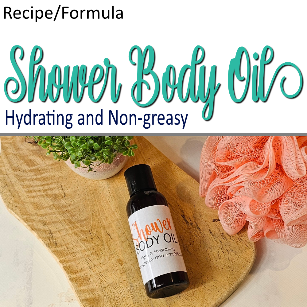 A product cover photo with the text SHOWER BODY OIL in teal cursive writing in the top half of the image against a white background.  The bottom half has a image of an amber bottle with black cap laying on a wooden surface with a simple product label facing up.  A nylon loofah sits the right and a potted plant to the top left